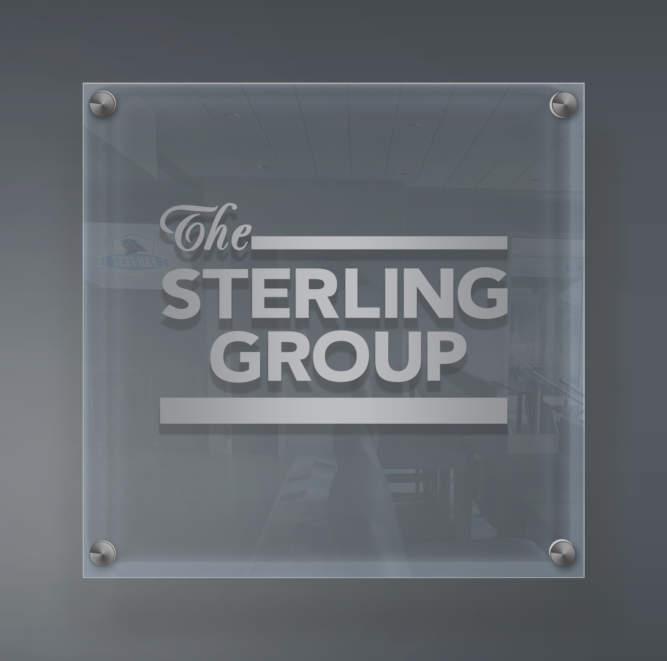 The Sterling Group glass sign inside the luxury suite